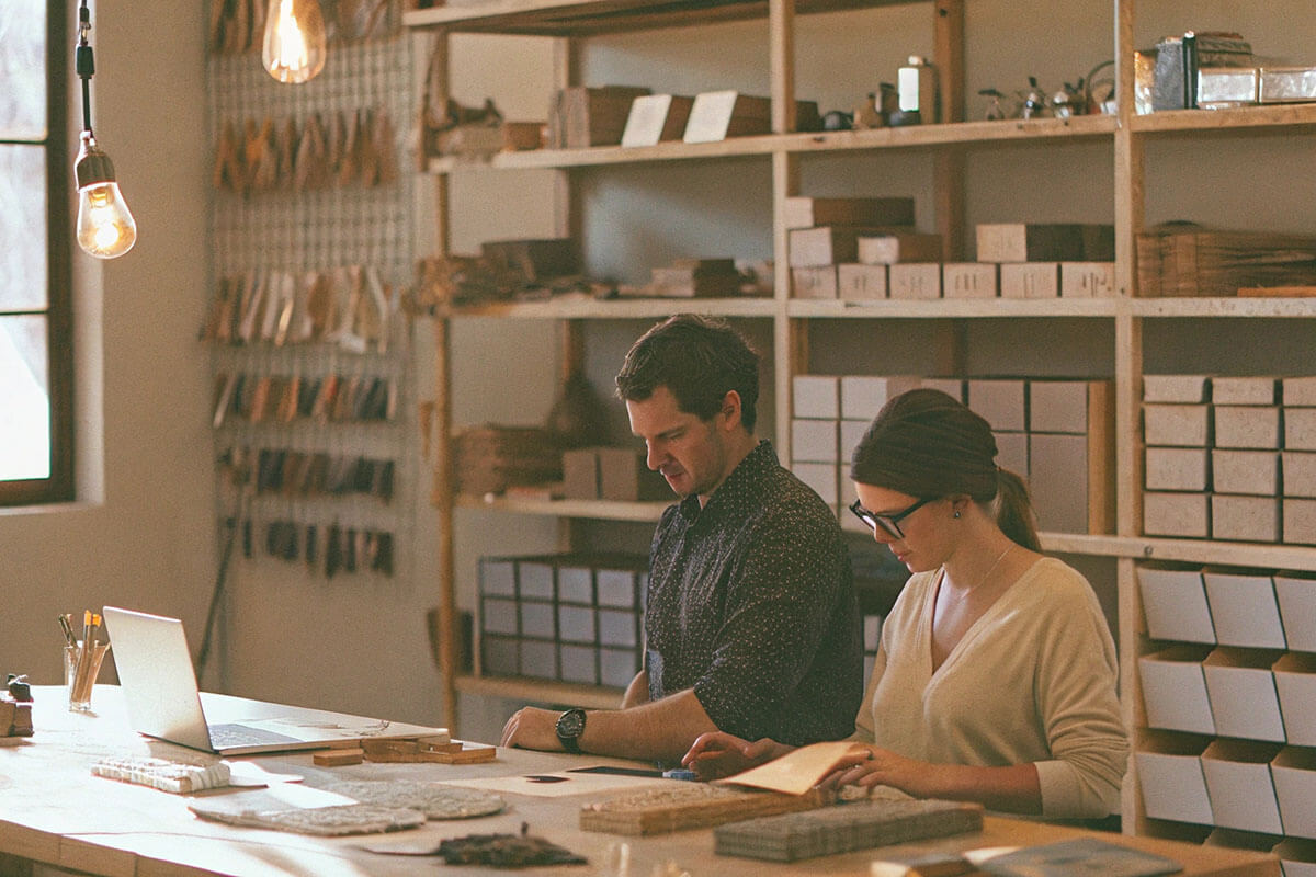 Efficient Workspace with Flexible Custom Packaging Organized workspace with small batch custom packaging products